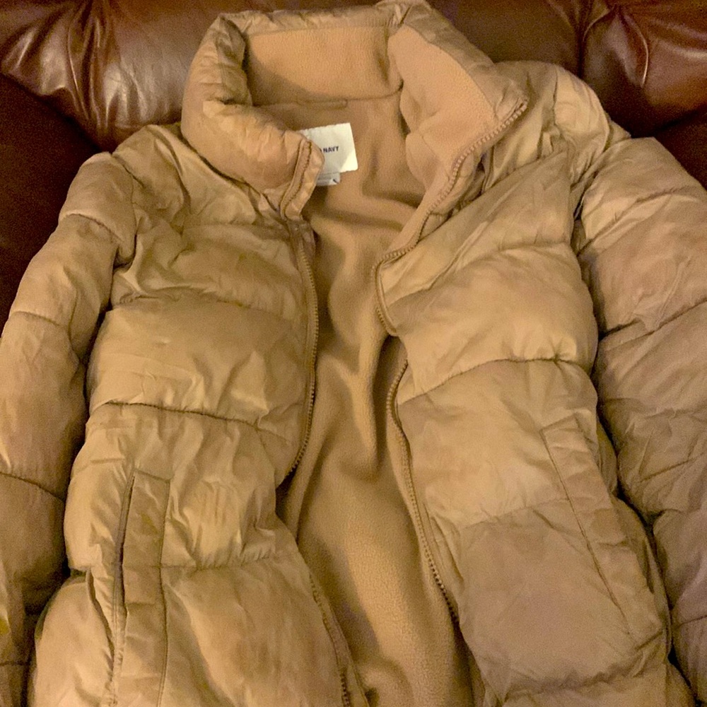 A women’s winter jacket with fleece on the inside.